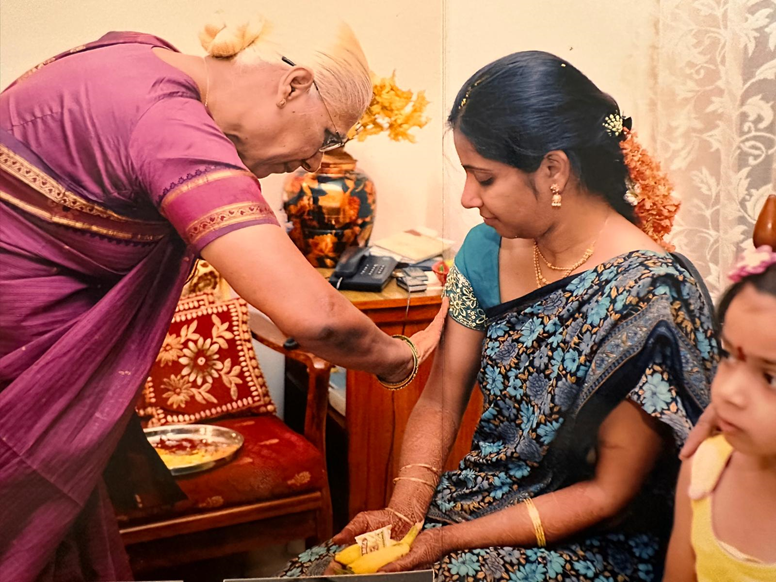 Bride receiving gifts during Nischayathartham